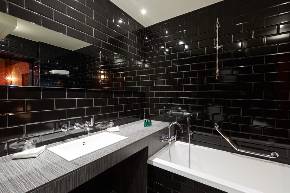 Deluxe Room | Bathroom | Designer toiletries, hair dryer, bathrobes, slippers