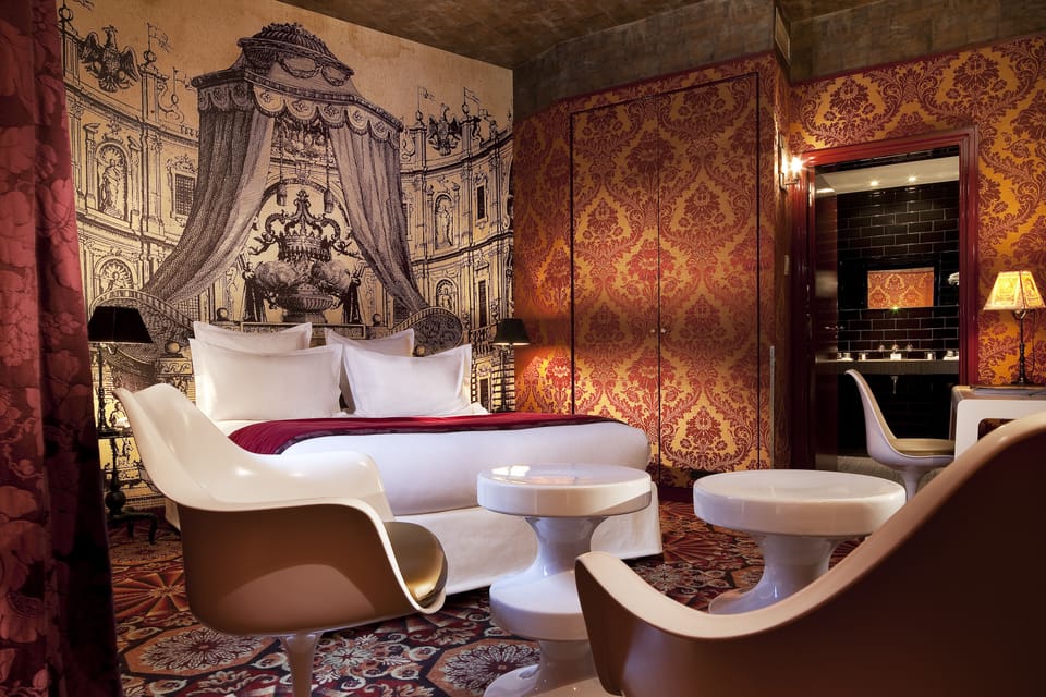 Deluxe Room | Minibar, in-room safe, individually decorated, individually furnished
