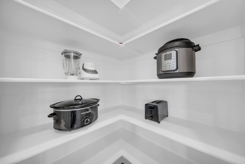 Everything you need to cook like a pro is already here. The kitchen is stocked with appliances for your convenience.