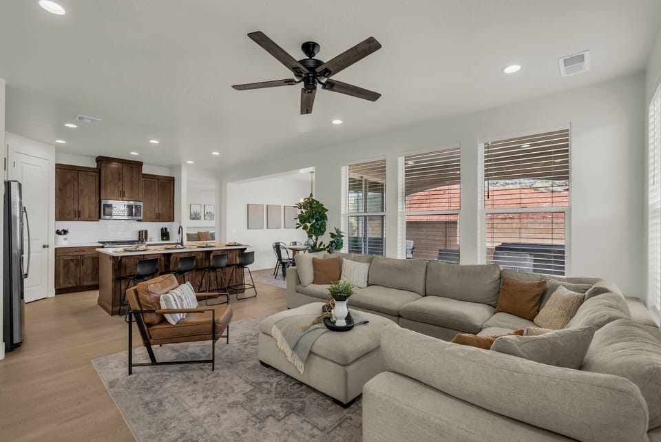 A wide-open view of the living and kitchen area shows just how much space this home has to offer. Great layout for groups who like to stay connected.