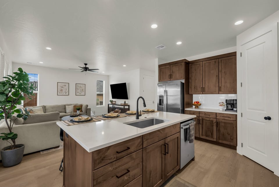 The kitchen opens right into the living space, making it easy to cook and stay in the conversation. Stainless steel appliances and a breakfast bar round it all out.