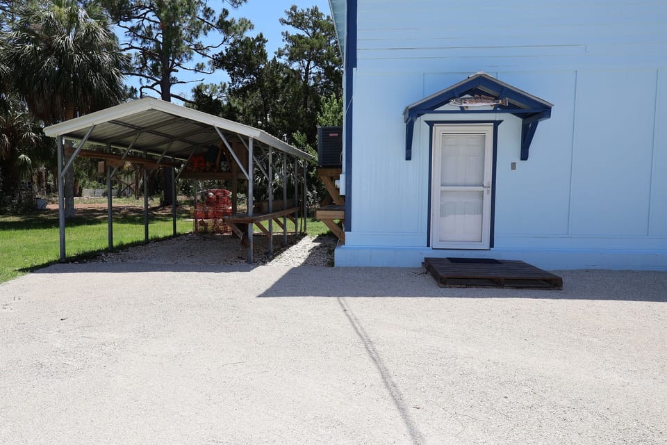 Main Entrance with covered golf cart parking