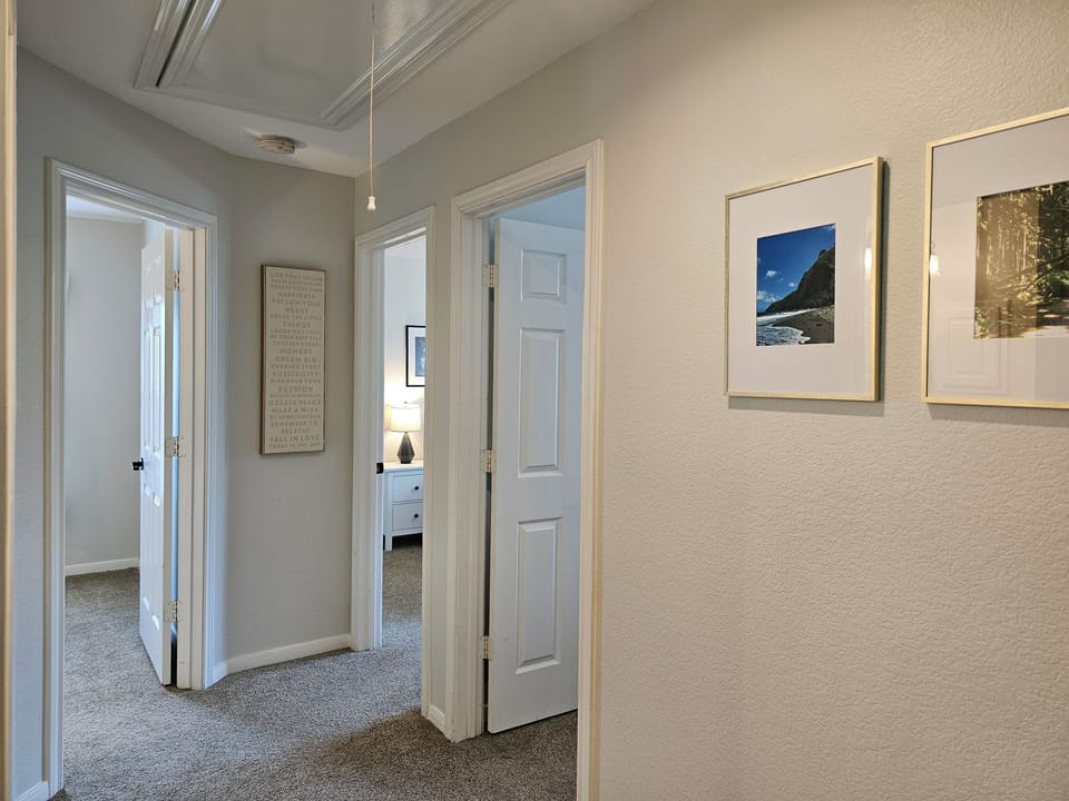 Upstairs hallway to 3 bedrooms and shared bathroom