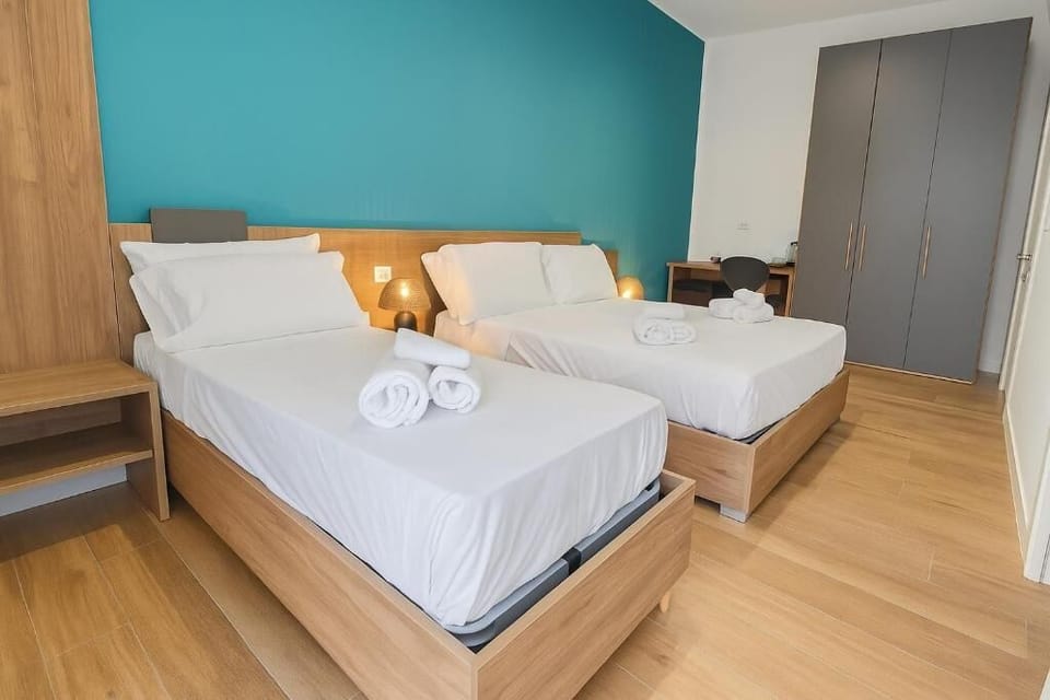 Luxury Triple Room, Balcony | Minibar, in-room safe, desk, laptop workspace