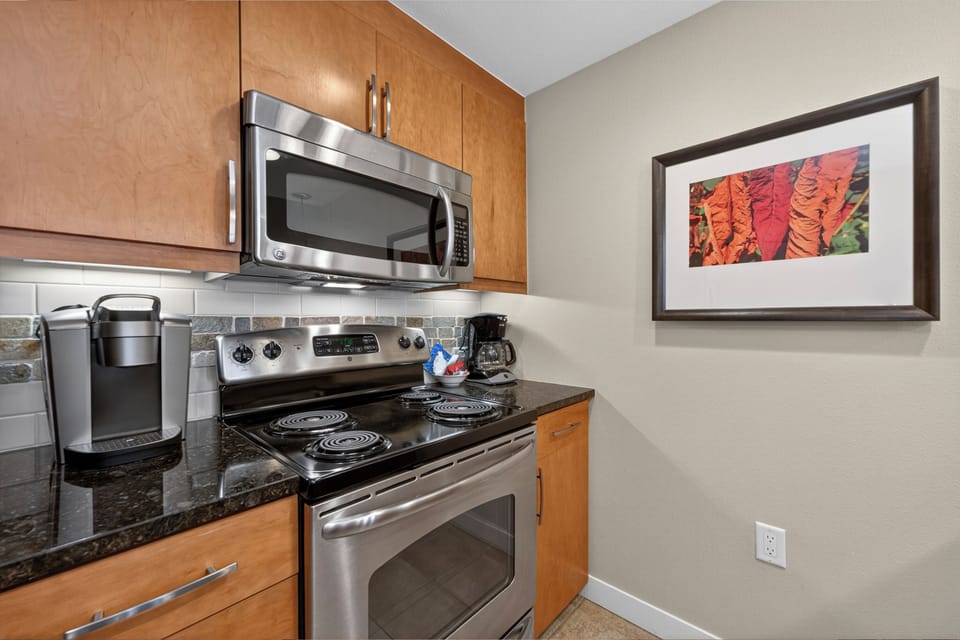 Your well-equipped kitchen features stainless steel appliances, granite countertops, and everything you need to prepare delicious home-cooked meals during your stay.