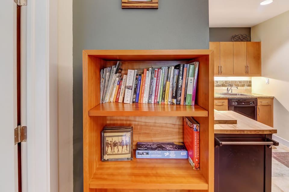 A curated library awaits your leisurely afternoons, with everything from cookbooks to travel guides at your fingertips in this thoughtfully designed space.