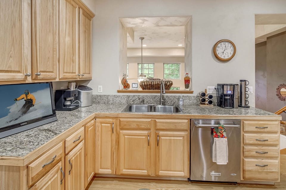 Your fully equipped kitchen features granite counters, stainless steel appliances, and everything you need to prepare memorable meals during your stay.