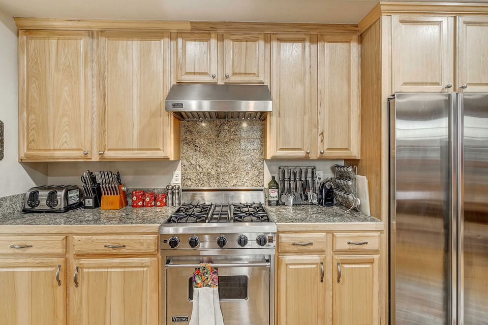 Your fully-equipped kitchen features granite countertops, stainless steel appliances, and a gas range—perfect for preparing meals during your stay.