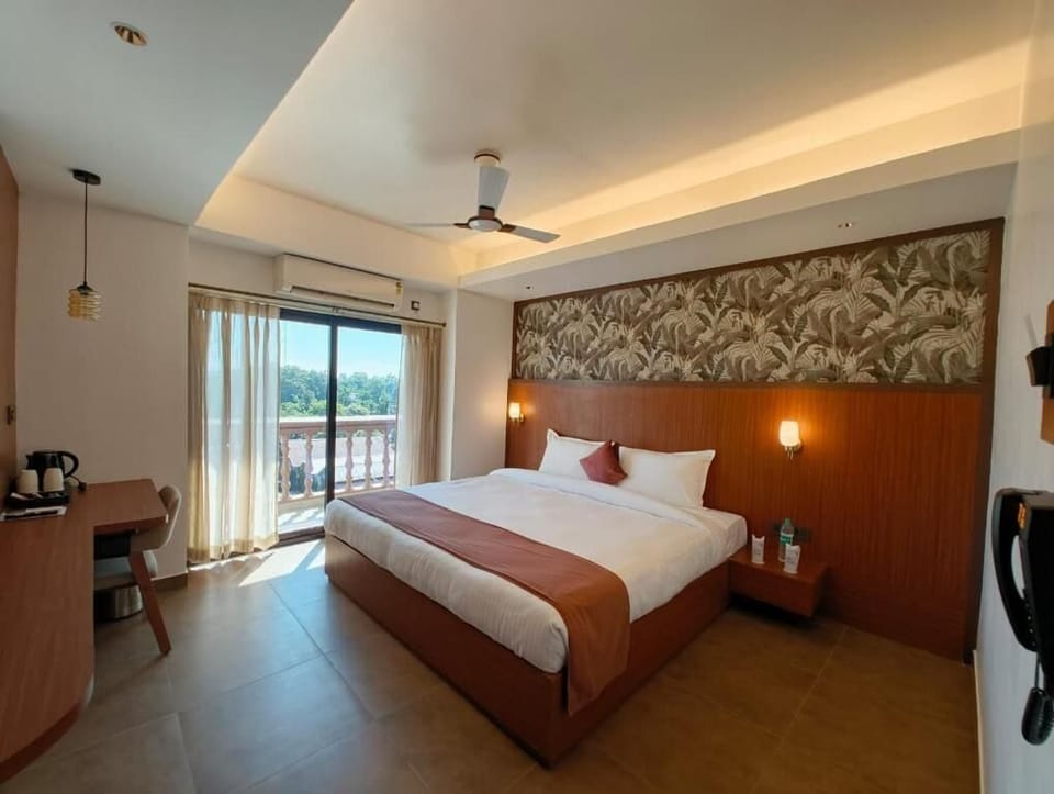 Executive Double Room, Balcony, City View | In-room safe, desk, soundproofing, iron/ironing board