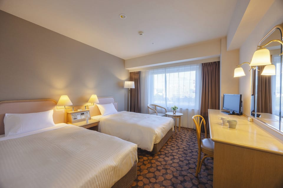 Premium bedding, down comforters, desk, laptop workspace