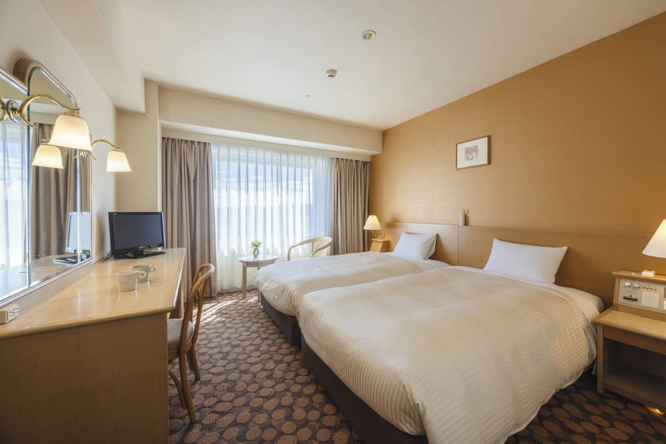 Premium bedding, down comforters, desk, laptop workspace