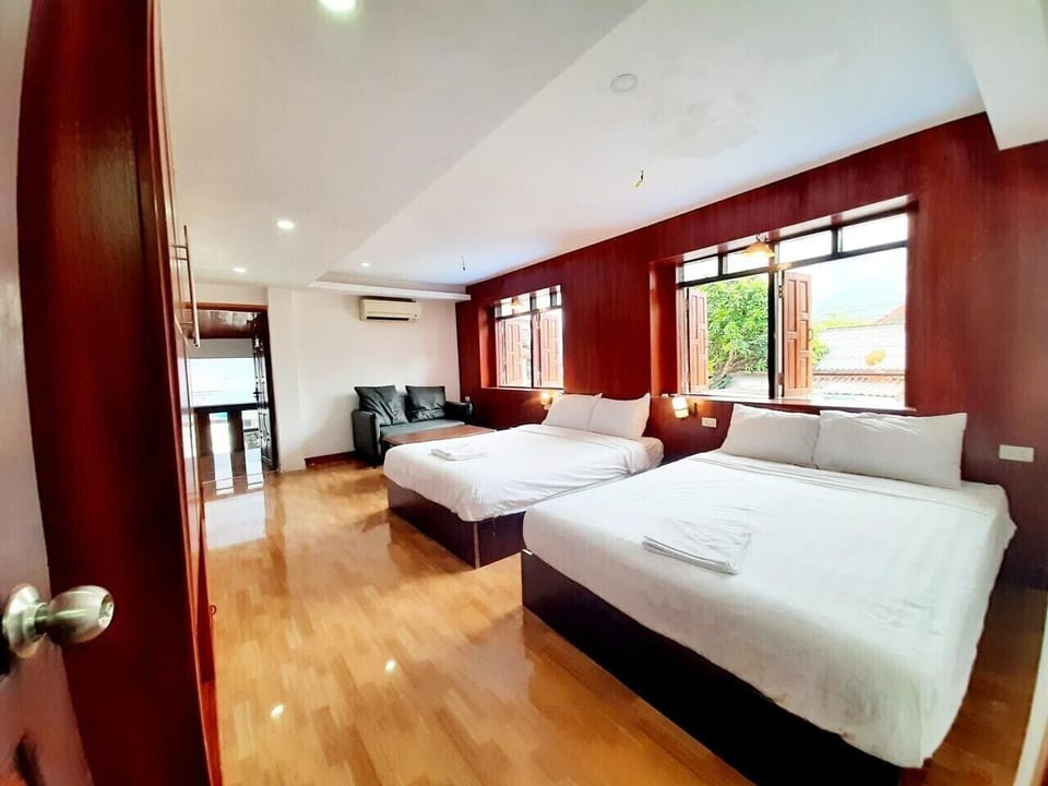 Deluxe Quadruple Room, Pool View | Desk