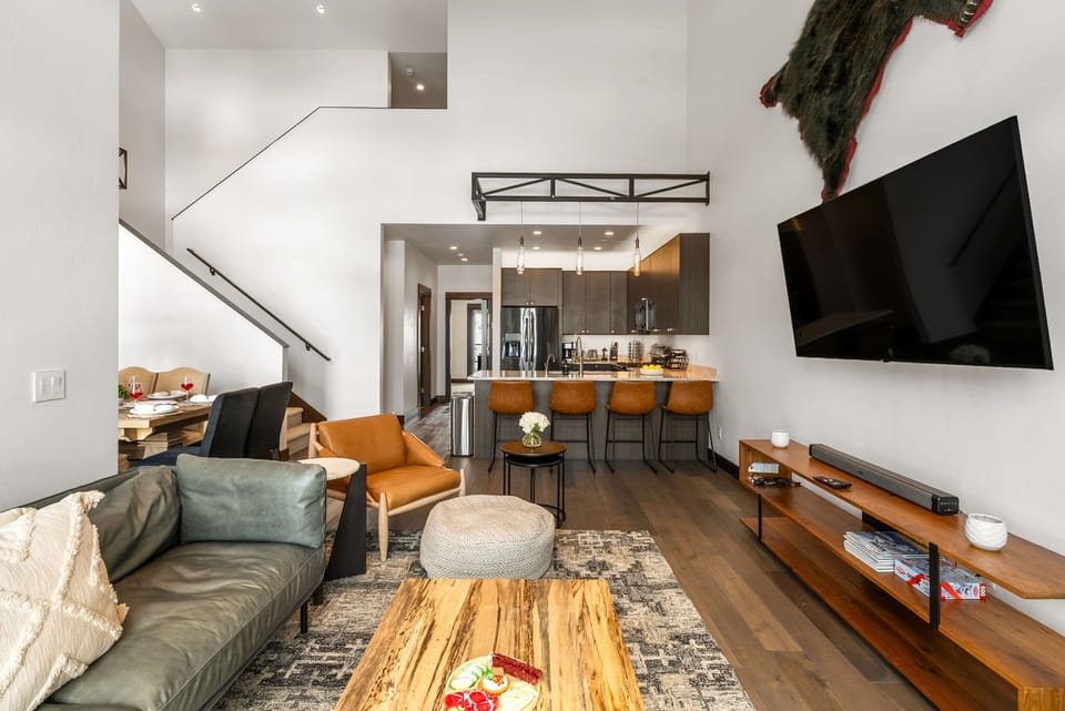 Living room: Gas fireplace, vaulted ceilings, mid-century modern furniture, main floor
