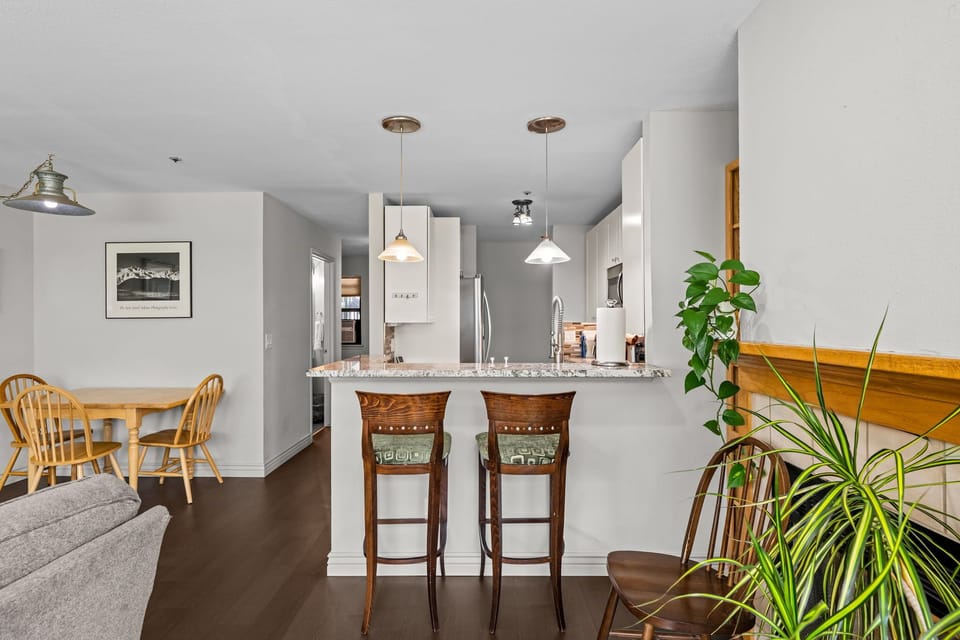 Kitchen - Dining table for 3 and bar seating for 2.