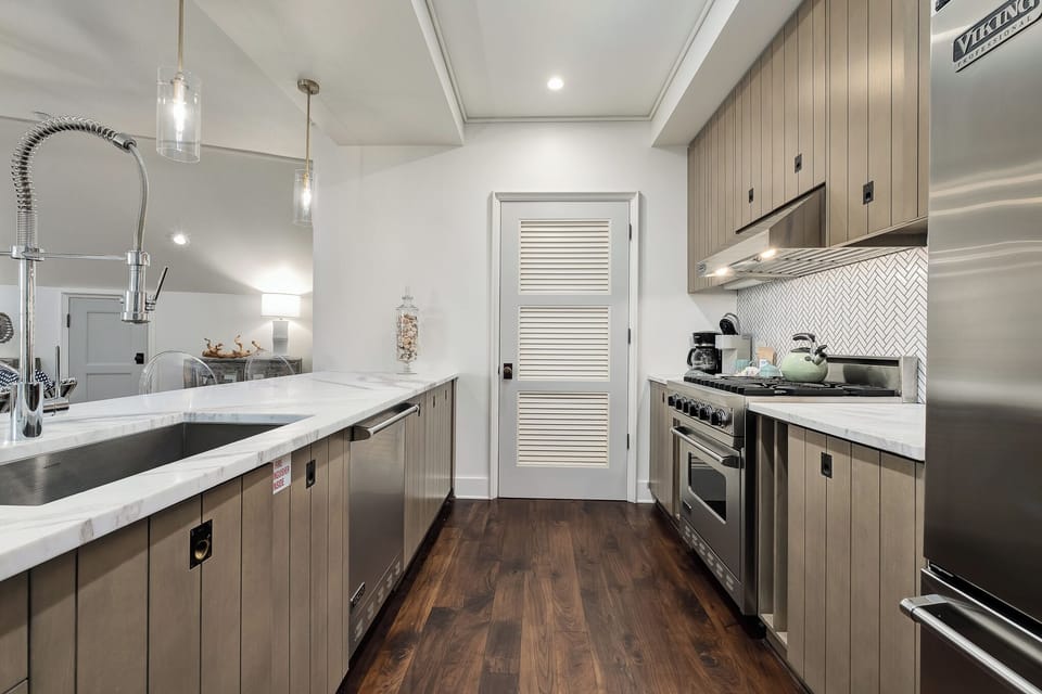 Chef kitchen equipped with high-end Viking appliances.  Marble countertops.