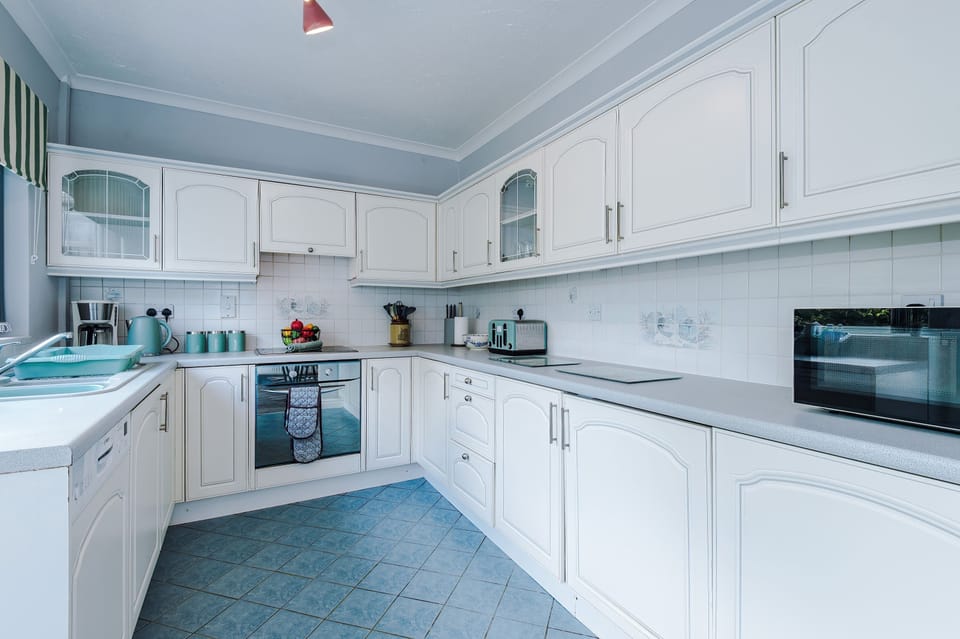 The fully equipped kitchen has everything you could possibly need to cook away from home. There is a microwave, toaster, kettle, oven and coffee machine.