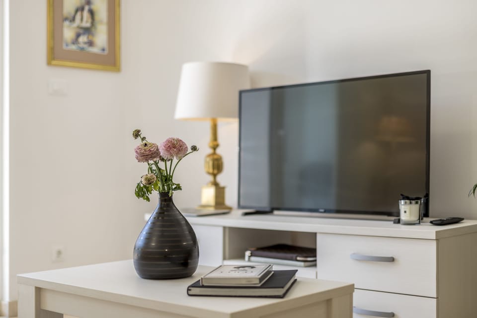 Deluxe Apartment, 1 Bedroom | Living area | LCD TV