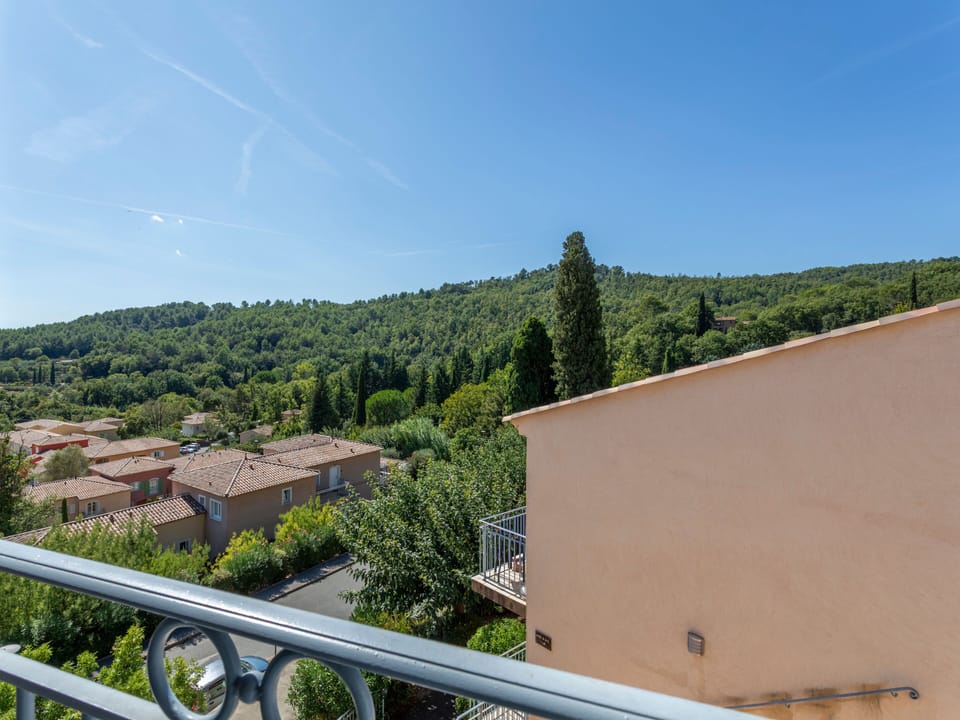 Pine-covered hills and blue skies from your private balcony