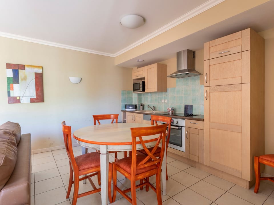 Dining area with table seating for the group, just off the kitchen and living space