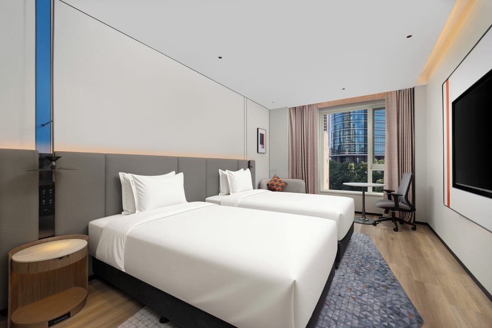 2 Single Standard Street View | Down comforters, desk, laptop workspace, blackout drapes