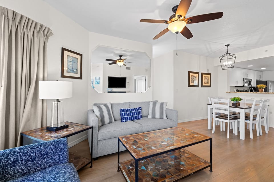 Unwind in the airy living room, complete with tasteful furniture and a warm ambiance.