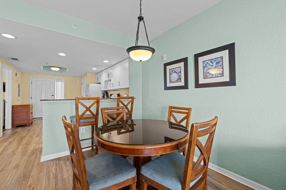 Gather around the round dining table, perfect for sharing meals and memories.