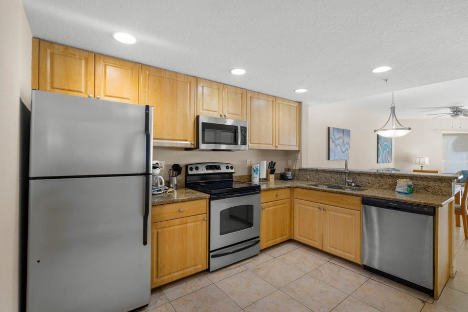 Cook up your culinary creations in this fully equipped kitchen, featuring modern appliances.