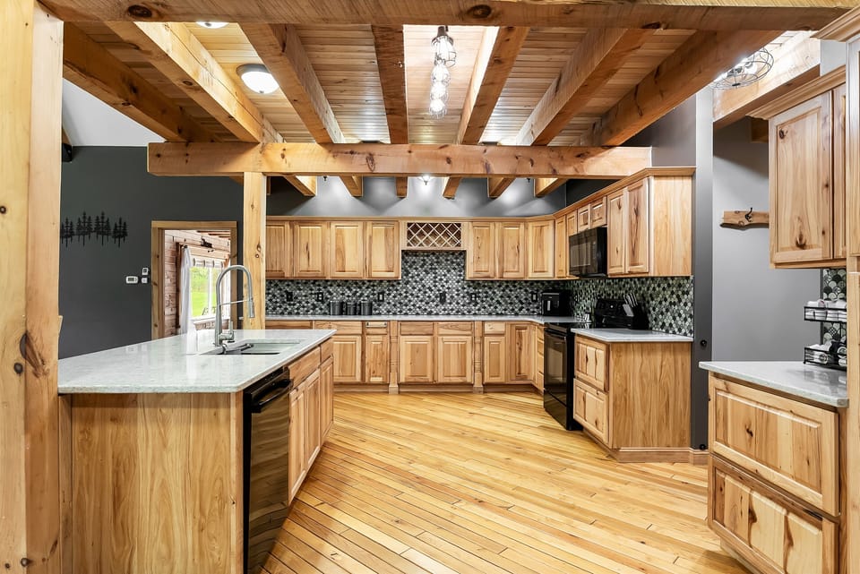 Huge kitchen with lots of counterspace, dishwasher, stove, microwave and air fryer.