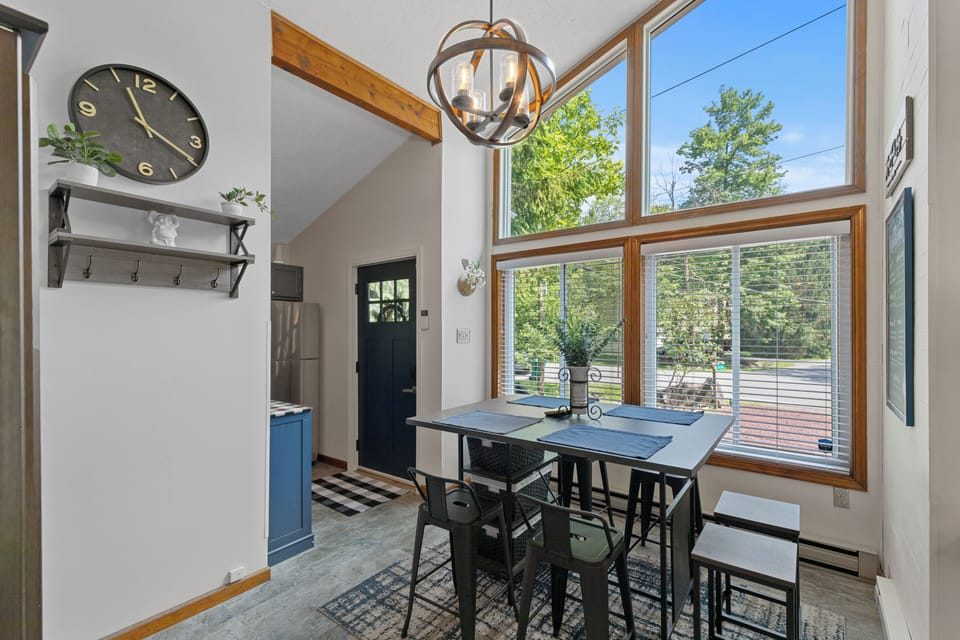 Bright dining area with woodland views, perfect for planning Pocono adventures.