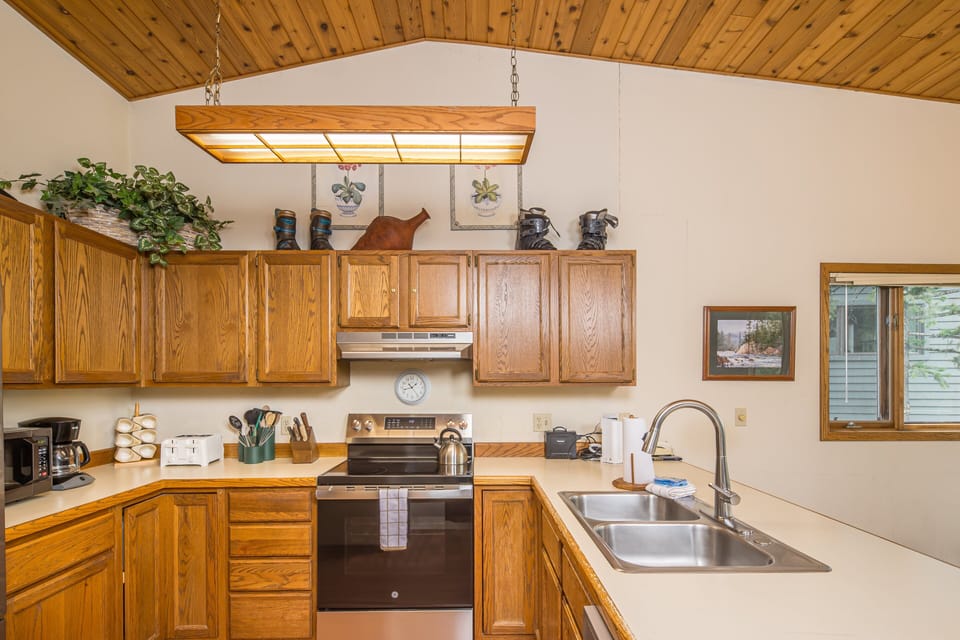 Ample counter space and natural light making home cooked meals easy | Upper Level