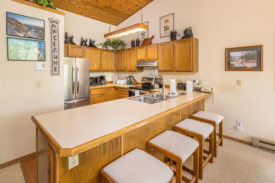 Fully equipped kitchen with stainless steal appliances and ample counter space | Upper Level