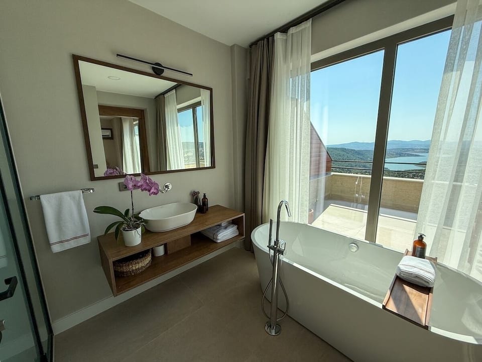 Superior Room, Balcony, Lake View | Bathroom | Hair dryer, slippers, towels, soap