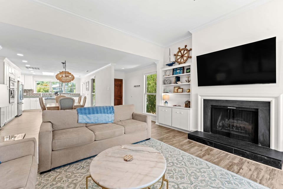 Bright open-concept living spaces designed for gathering after a day at the beach or pool