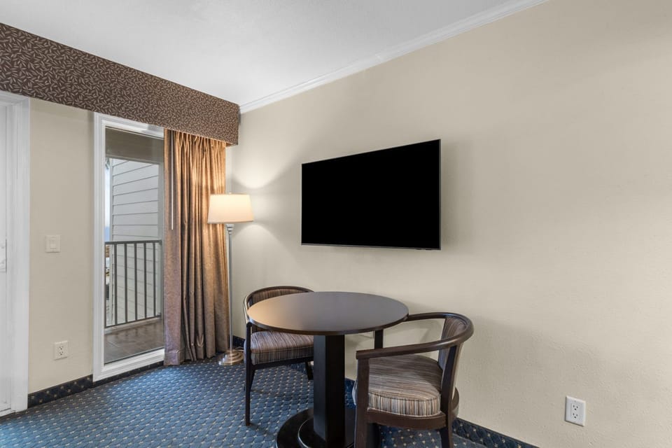 Step onto your private balcony and take in the inviting ambiance from this stylish seating area.