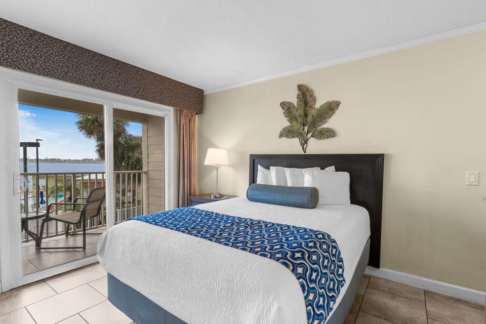 Relax in comfort with your own queen bed and access to the balcony for fresh breezes.
