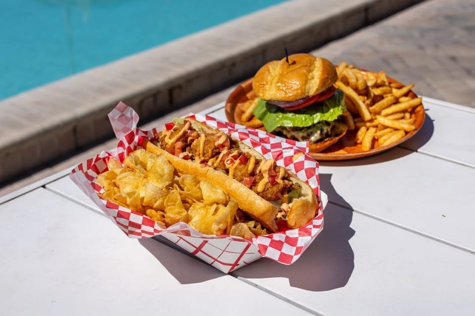 Indulge in delicious bites from the poolside bar, perfect for unwinding in the sun.