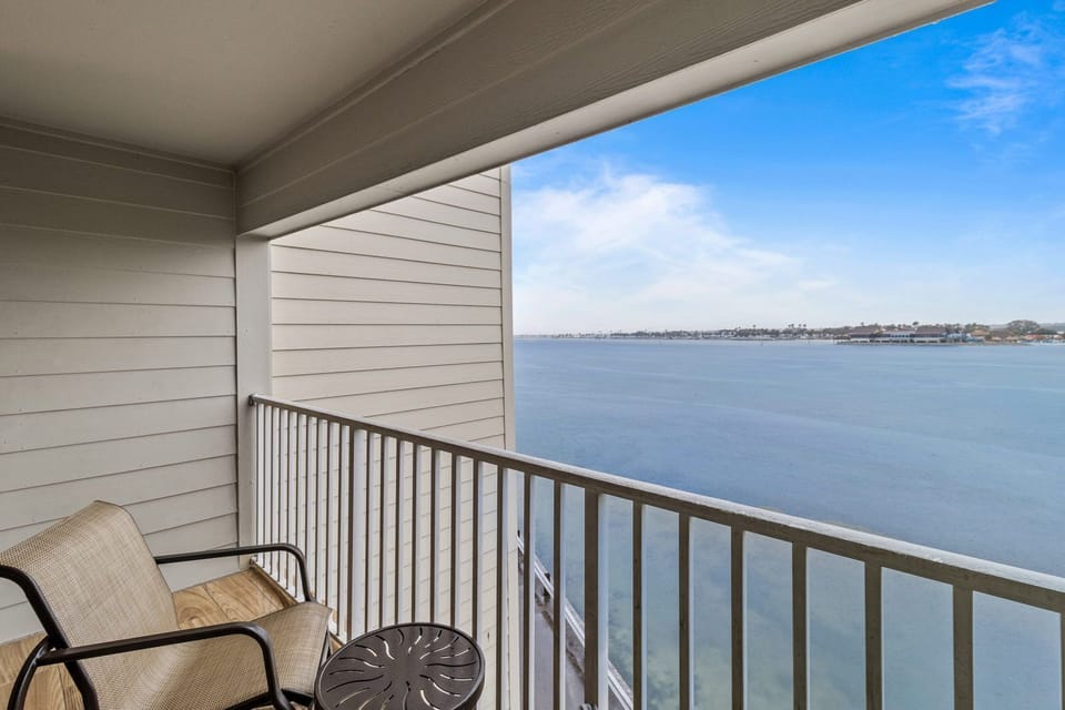 Enjoy your morning coffee on the private balcony overlooking tranquil waters.