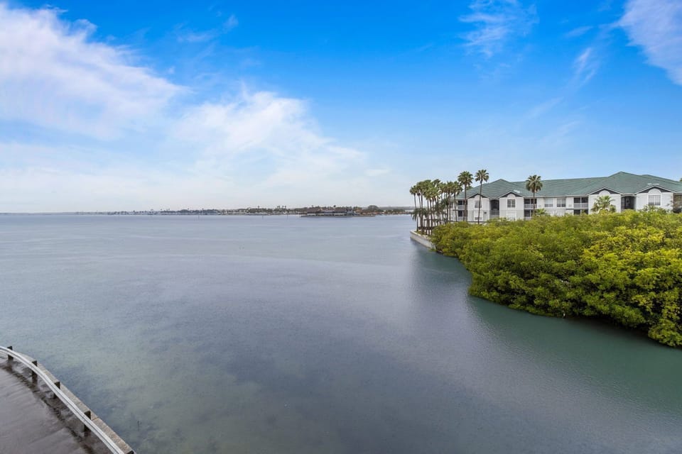 Relax by the serene waters, where lush greenery meets calm blue.