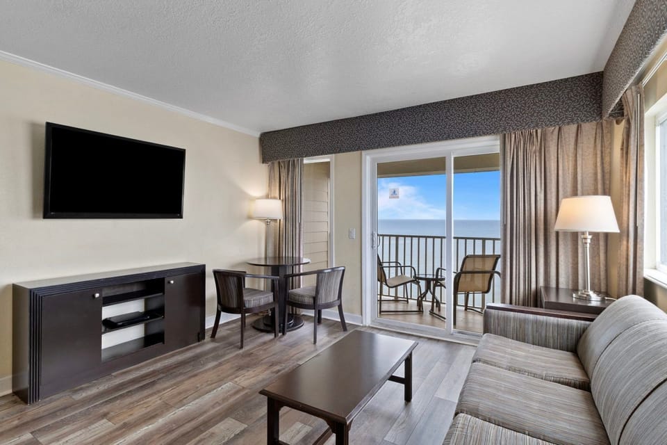 Natural light pours in, illuminating the inviting living area perfect for gathering or enjoying a quiet moment.