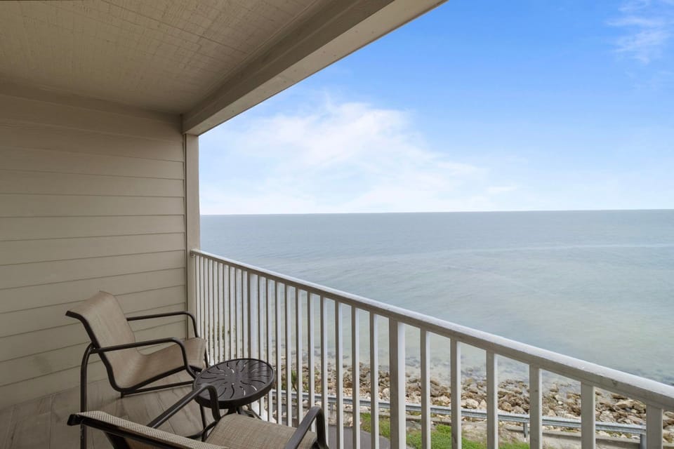 Breathe in the refreshing ocean air from your private balcony, perfect for enjoying morning coffee.