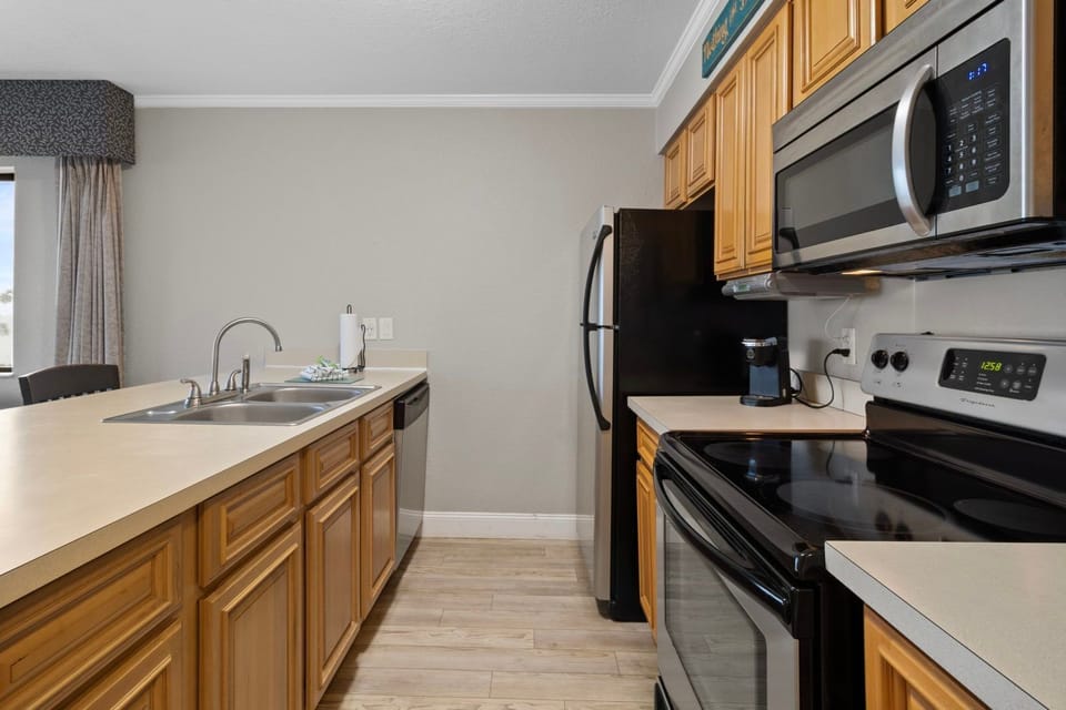 Cook up your favorites in a spacious kitchen, fully equipped with modern appliances and sleek countertops.