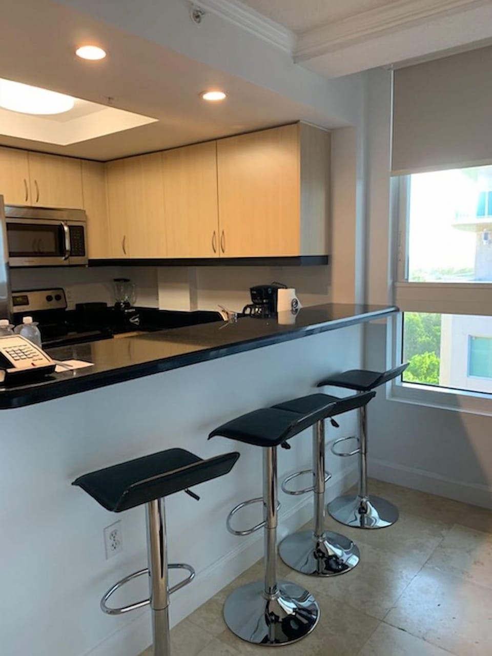 Cook up your favorite meals in a modern kitchen equipped with sleek appliances and bar seating for casual dining.