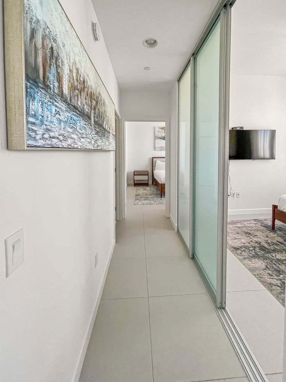 A spacious hallway leads you to beautifully decorated bedrooms, setting the tone for restful nights.