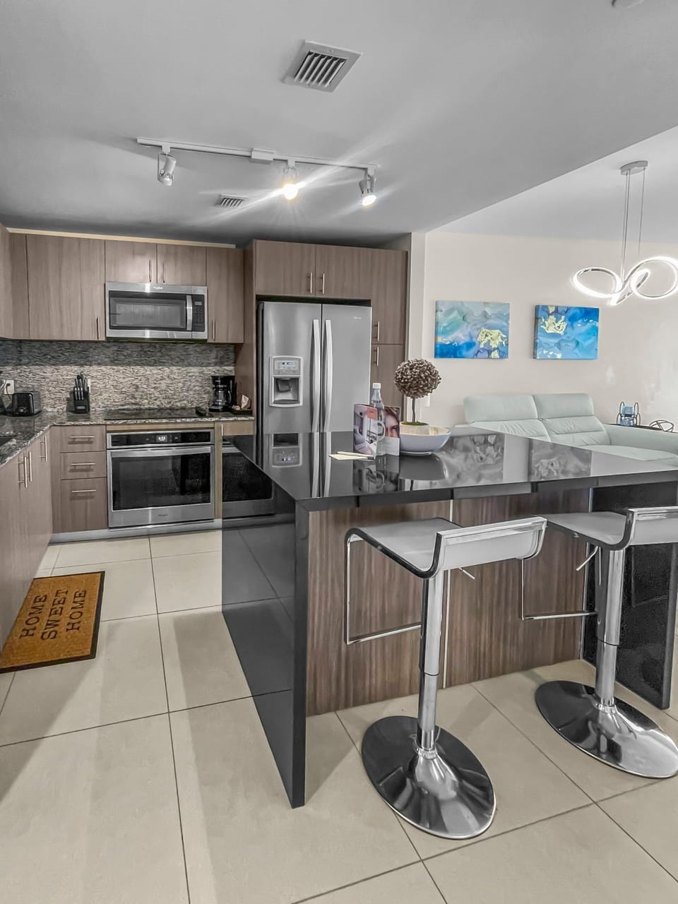Cook in style in this sleek kitchen, equipped with stainless steel appliances and a spacious layout.