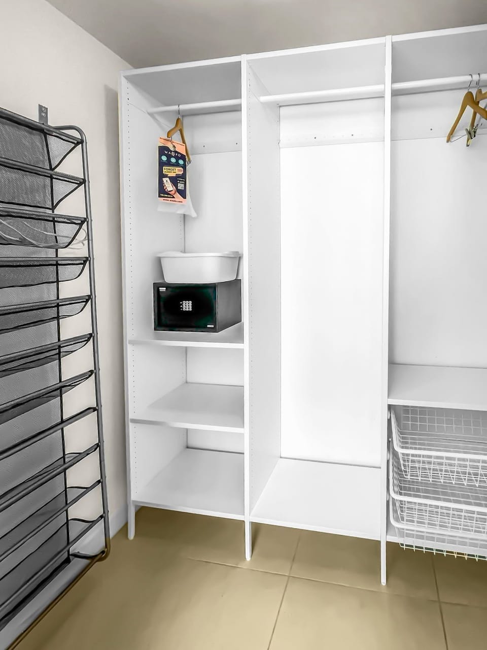 Store your belongings easily in this spacious, organized closet with a safe.
