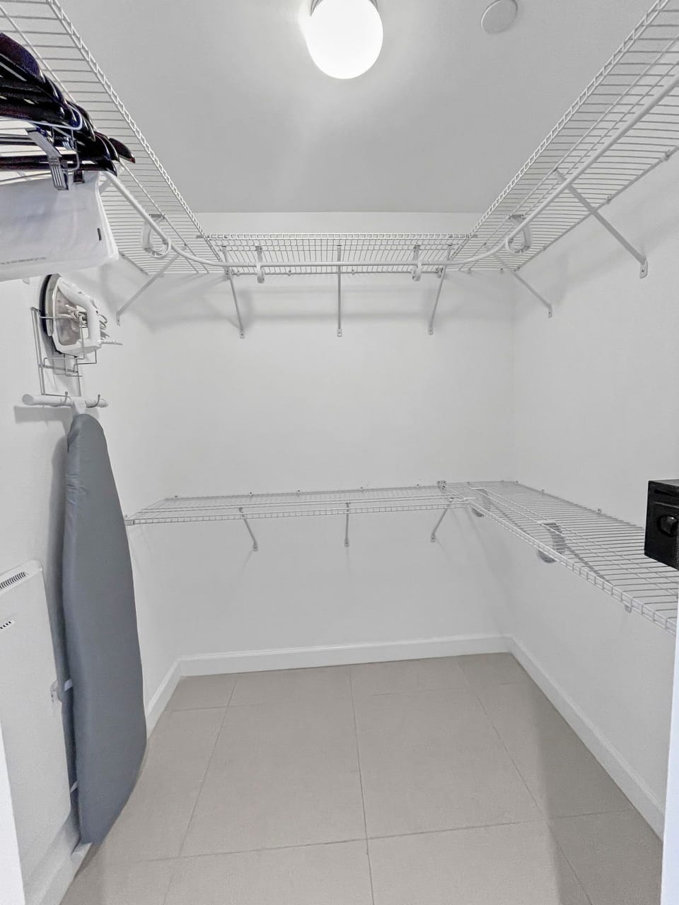 Enjoy a spacious closet featuring ample shelving and hangers for all your belongings.