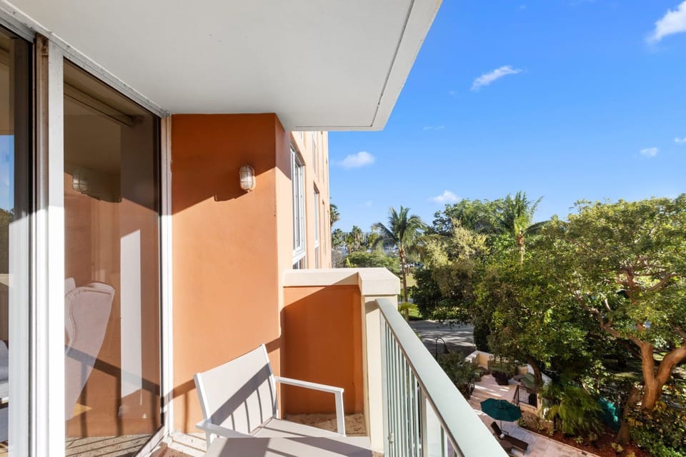 Step onto your balcony and embrace the tranquility, surrounded by swaying palms and vibrant foliage.