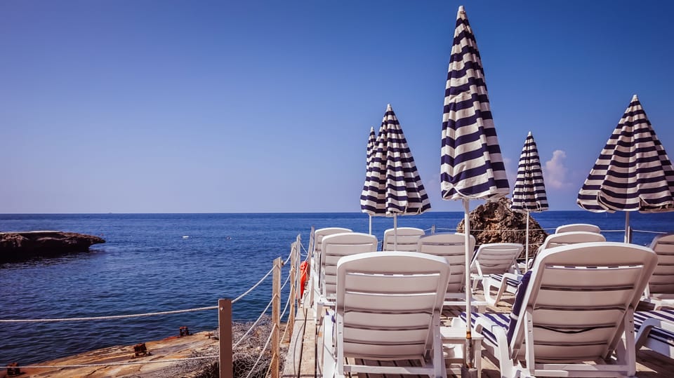 On the beach, sun loungers, beach umbrellas, beach towels