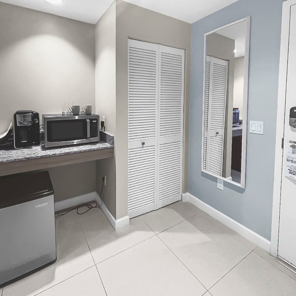 Enjoy a cozy kitchenette featuring sleek appliances, perfect for light meals and snacks.