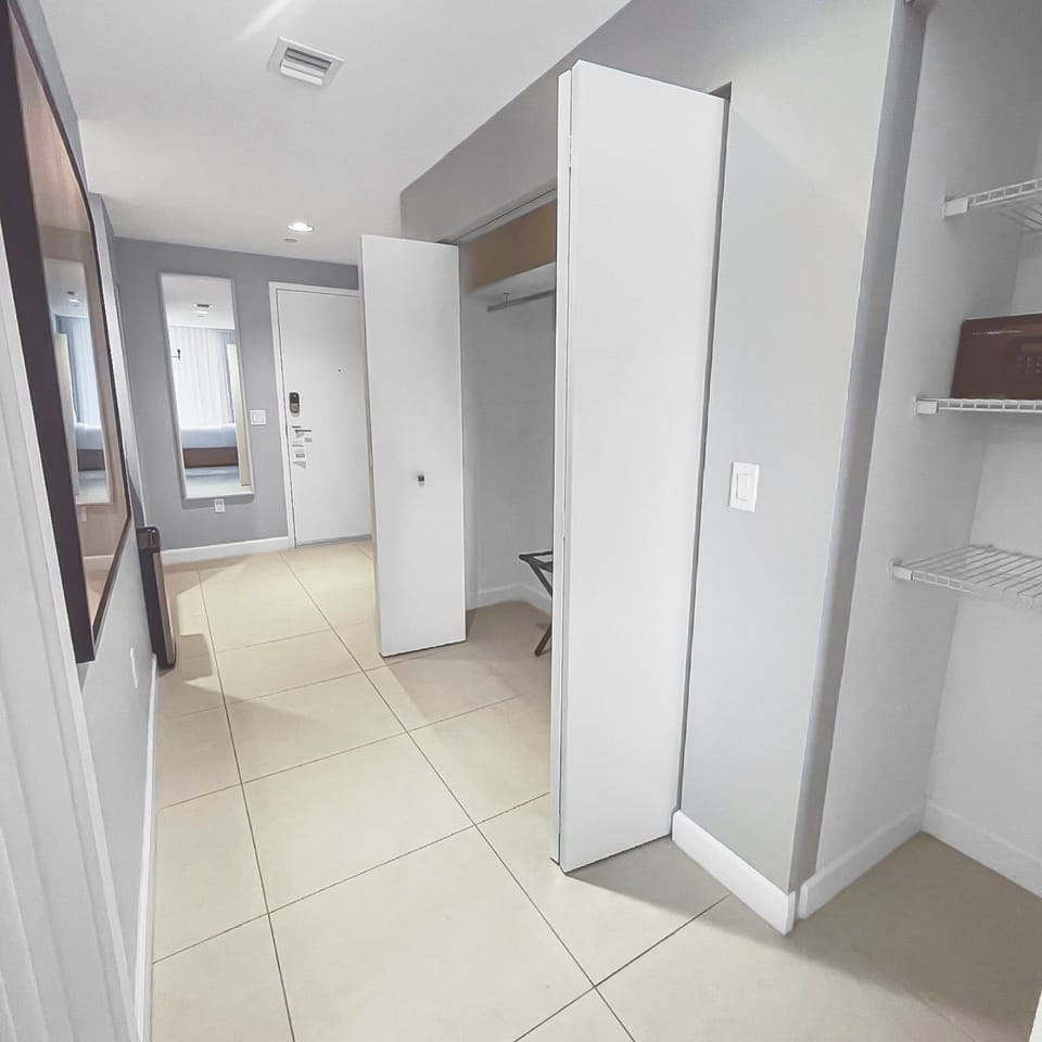 Step into a modern entryway that welcomes you with clean lines and stylish decor.
